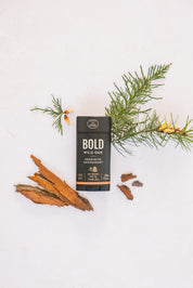 Bold Wild Oak Prebiotic Deodorant with natural ingredients arrayed around it. 
